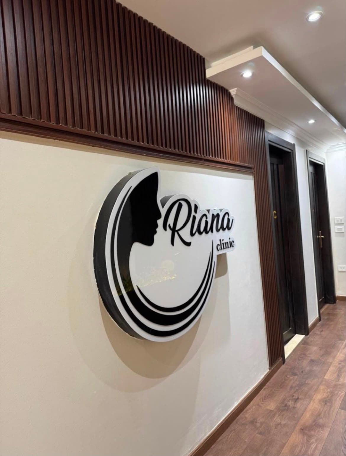 A physiotherapist supporting a client at Oriana Clinic